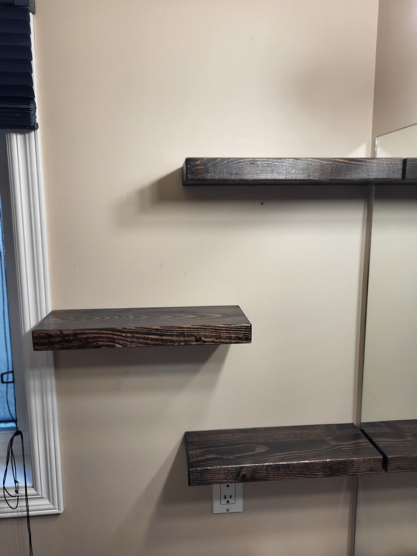 Three empty handcrafted floating wooden shelves mounted on a wall made in Saskatoon, Saskatchewan