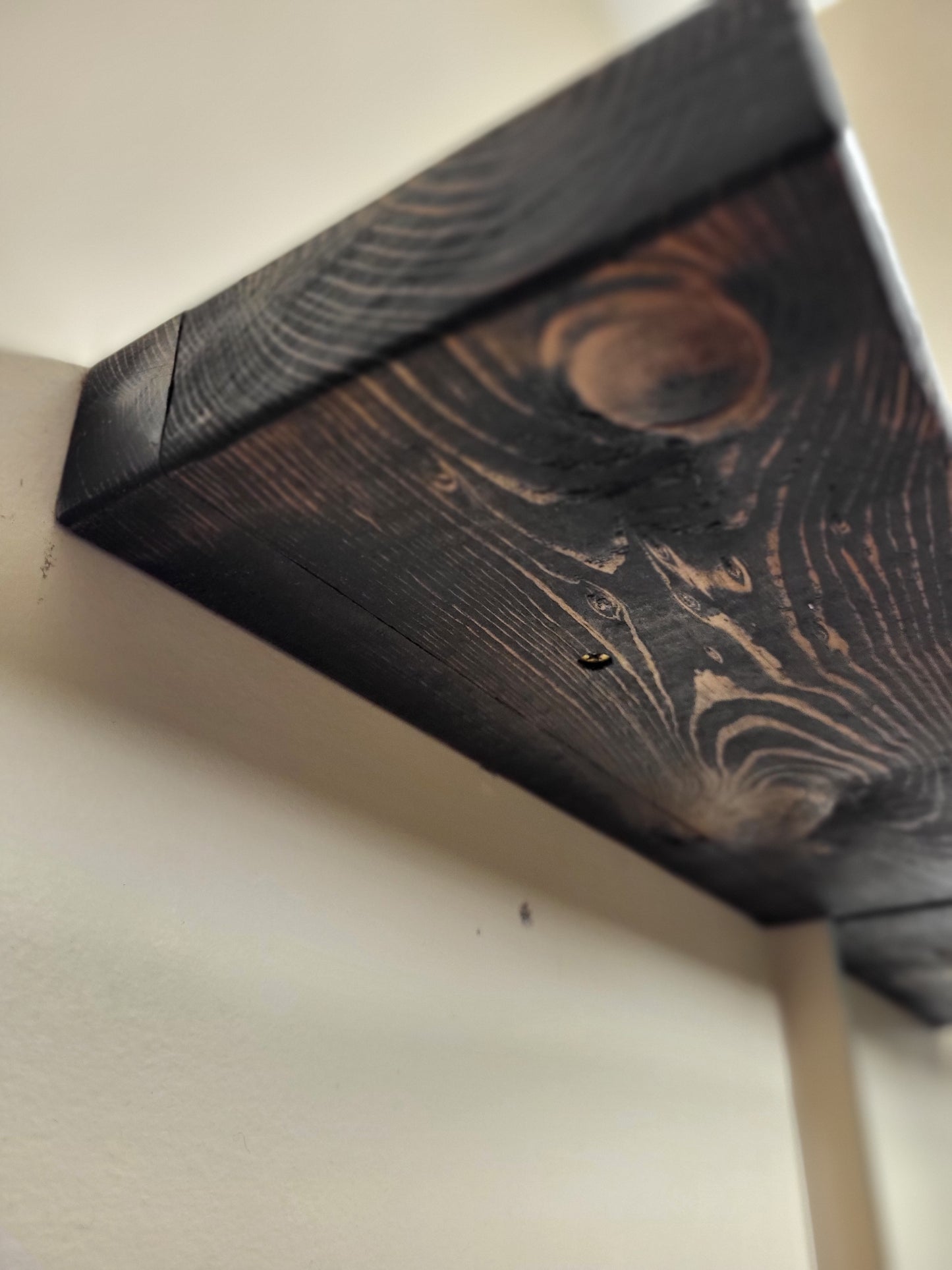 Closeup of underside of a floating wooden shelf made in Saskatoon, Saskatchewan
